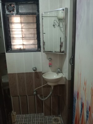 Bathroom in 2 BHK Apartment at Badri Kedar Building, Seawoods Sector 40 – for Rent