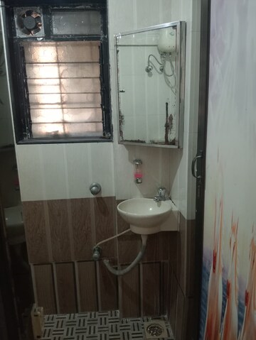 Bathroom in 2 BHK Apartment at Badri Kedar Building, Seawoods Sector 40 – for Rent