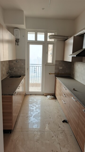 Kitchen in 3.5 BHK Apartment at ATS Homekraft Pious Hideaways, Sector 150 – for Rent