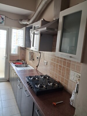 Kitchen in 3 BHK Apartment at Mahagun Moderne, Sector 78 – for Rent