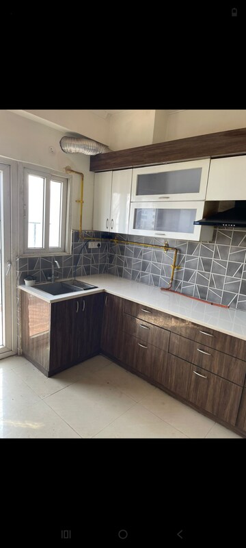 Kitchen in 2 BHK Apartment at Amrapali Heartbeat City, Sector 107 – for Rent