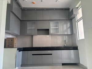 Kitchen in 3 BHK Apartment at JKG Palm Court, Sector 16c Greater Noida – for Rent