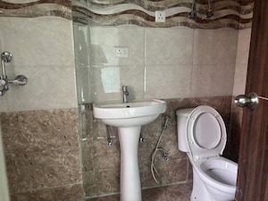 Bathroom in 3 BHK Apartment at JKG Palm Court, Sector 16c Greater Noida – for Rent