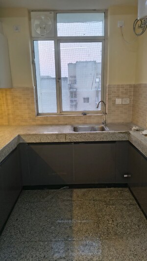 Kitchen in 3 BHK Apartment at Raheja Vedaanta, Sector 108 – for Rent