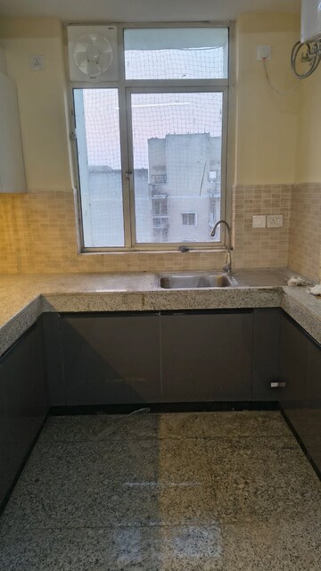 Kitchen in 3 BHK Apartment at Raheja Vedaanta, Sector 108 – for Rent