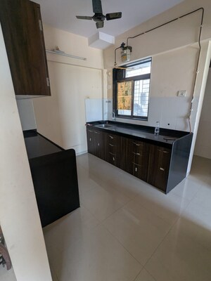 Kitchen in 1.5 BHK Apartment at Shree Satya Shankar Residency, Manpada – for Rent