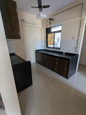 Kitchen in 1.5 BHK Apartment at Shree Satya Shankar Residency, Manpada – for Rent