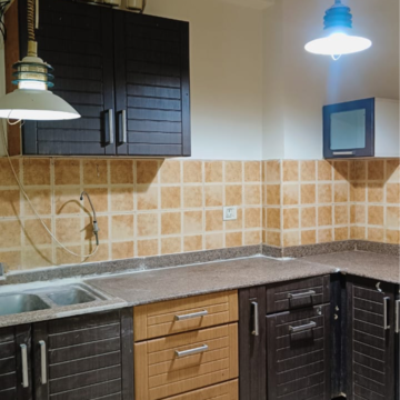 Kitchen in 2 BHK Apartment at Amrapali Eden Park, Sector 51 – for Rent