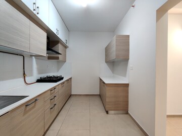 Kitchen in 3 BHK Apartment at Bhartiya Nikoo Homes Phase 2, Thanisandra Main Road – for Rent