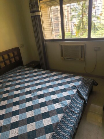 Bedroom in 2 BHK Apartment at Satellite Garden, Goregaon East – for Sale