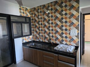 Kitchen in 3 BHK Apartment at Sargam CHS Nanded, Sinhagad Road – for Sale