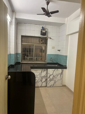 Kitchen in 2 BHK Apartment at Neelkanth Greens, Manpada – for Rent