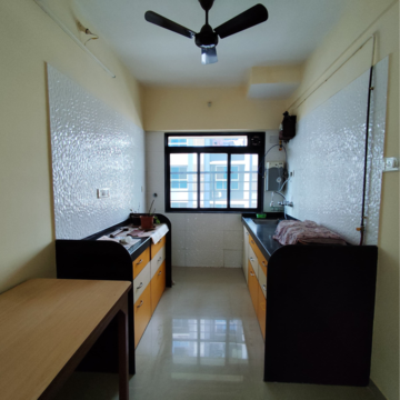 Kitchen in 1.5 BHK Apartment at Amal Aspen Park, Sonawala Industry Estate – for Rent