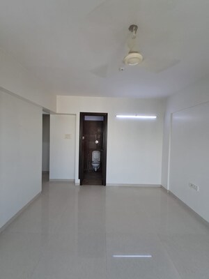 Room in 2 BHK Apartment at PR Wood Wind, Andheri East – for Rent