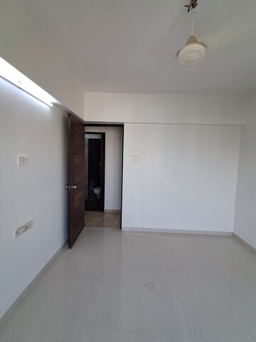 Room in 2 BHK Apartment at PR Wood Wind, Andheri East – for Rent