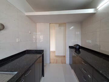 Kitchen in 2 BHK Apartment at PR Wood Wind, Andheri East – for Rent