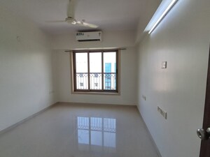Room in 2 BHK Apartment at PR Wood Wind, Andheri East – for Rent