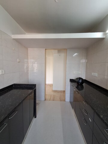 Kitchen in 2 BHK Apartment at PR Wood Wind, Andheri East – for Rent