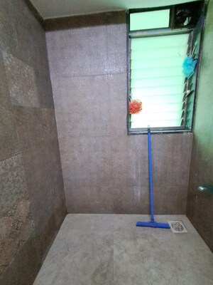 Bathroom in 2 BHK Apartment at PR Wood Wind, Andheri East – for Rent