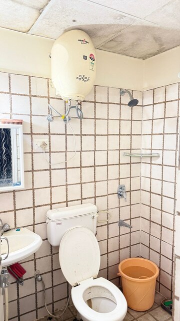 Bathroom in 1 BHK Apartment at NK Sharma Savitry Greens, Lohgarh – for Rent