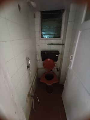 Bathroom in 1 BHK Apartment at Rishikesh CHS, Malad West – for Rent