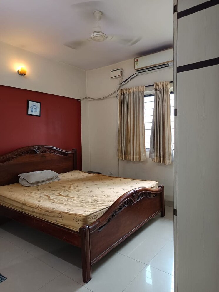 Bedroom, magarpatta-city-cosmos 2 Bedroom 1050 Sq.Ft. Apartment In Magarpatta Road Pune 9479361