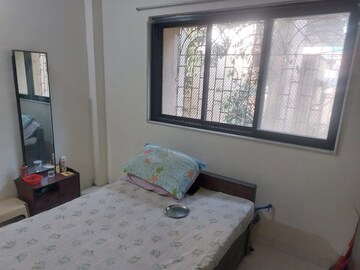 Bedroom in 2 BHK Apartment at Sector 15 Kopar Khairane – for Rent