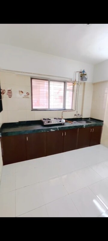 Kitchen in 1 BHK Apartment at Karan Rhea, Wadegaon – for Rent