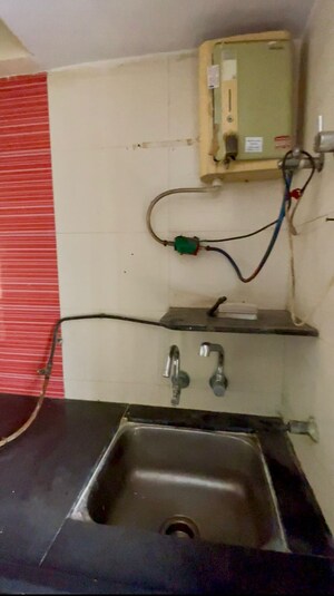 Kitchen in 1 BHK Apartment at Poonam Estate Cluster I, Mira Road – for Sale