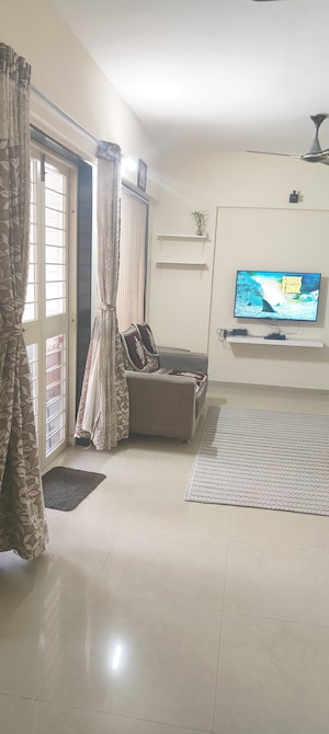 Living Room in 2 BHK Apartment at Siddhi Nisarg, Wakad – for Rent
