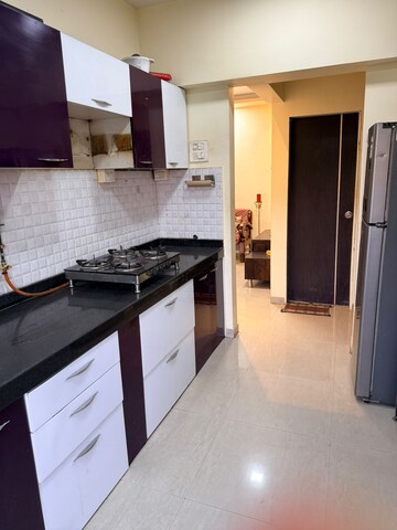 Kitchen in 2 BHK Apartment at Rosa Gardenia, Ghodbunder Road – for Rent