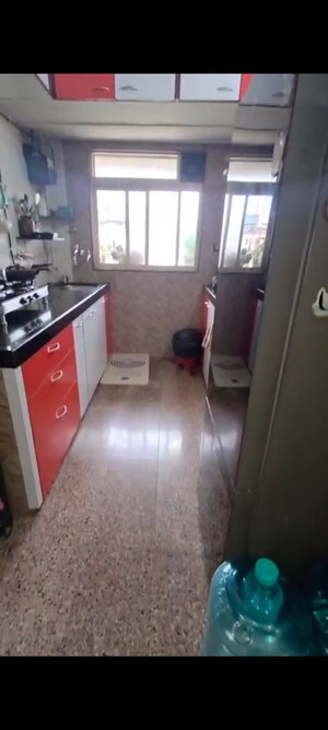 Kitchen in 2 BHK Apartment at Prem Karan Complex, Mira Road – for Sale