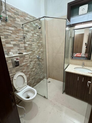 Bathroom in 4 BHK Builder Floor at Ansal Sushant Shopping Arcade, Sector 27 – for Rent