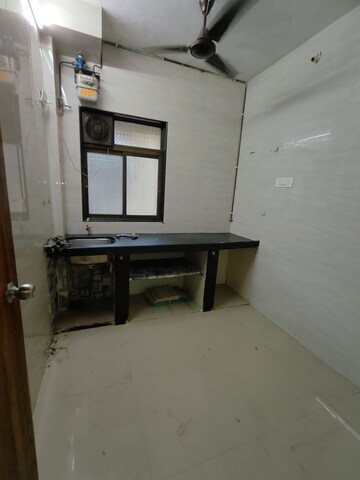 Kitchen in 1 RK Apartment at Saraf Chaudhary Nagar CHS, Kandivali East – for Sale