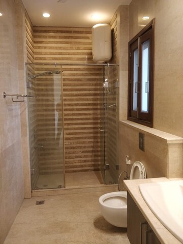 Bathroom in 4 BHK Apartment at Defence Colony – for Rent