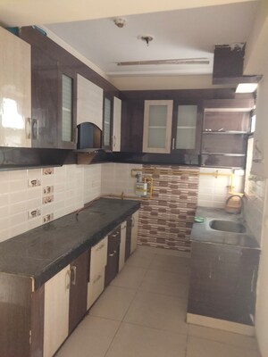Kitchen in 2.5 BHK Apartment at Charms Castle, Raj Nagar Extension – for Rent