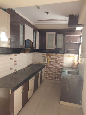 Kitchen in 2.5 BHK Apartment at Charms Castle, Raj Nagar Extension – for Rent