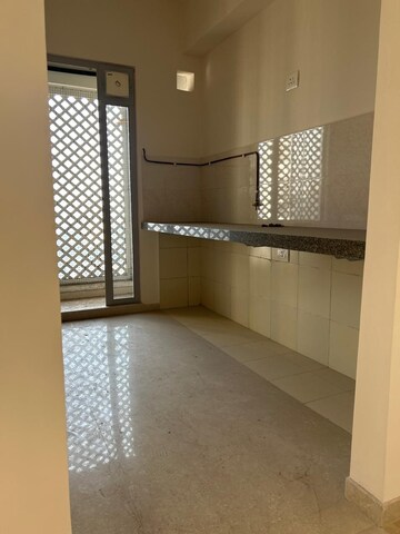 Kitchen in 2 BHK Apartment at Piramal Vaikunth, Balkum Pada – for Rent