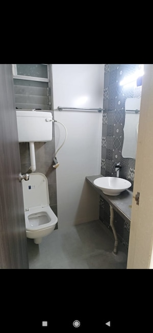 Bathroom in 3 BHK Apartment at Unique Poonam Estate Cluster 2, Mira Road – for Sale