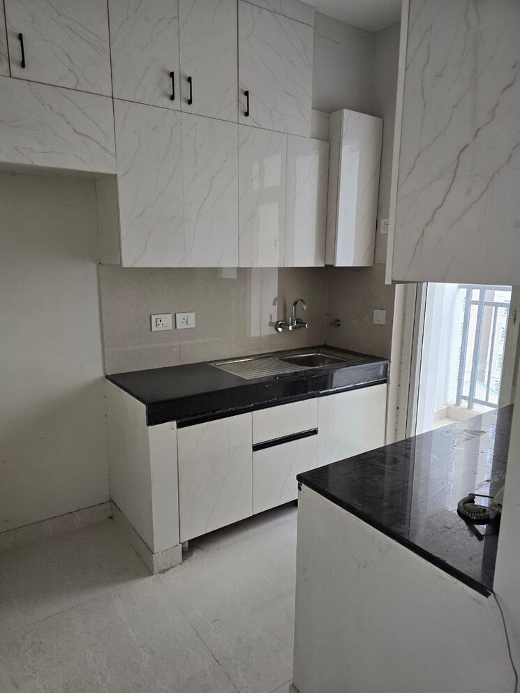 Kitchen, eldeco-live-by-the-greens 2 Bedroom 1155 Sq.Ft. Apartment In Sector 150 Noida 9490837