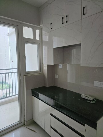 Kitchen in 2 BHK Apartment at Eldeco Live By The Greens, Sector 150 – for Rent
