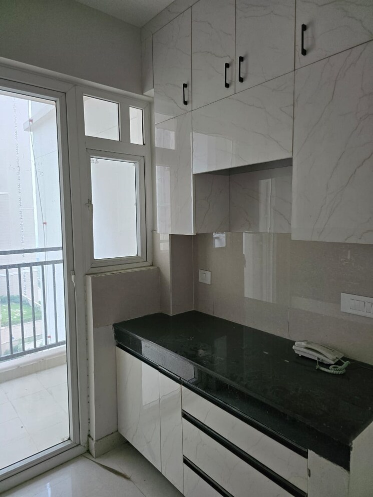 Kitchen, eldeco-live-by-the-greens 2 Bedroom 1155 Sq.Ft. Apartment In Sector 150 Noida 9490837