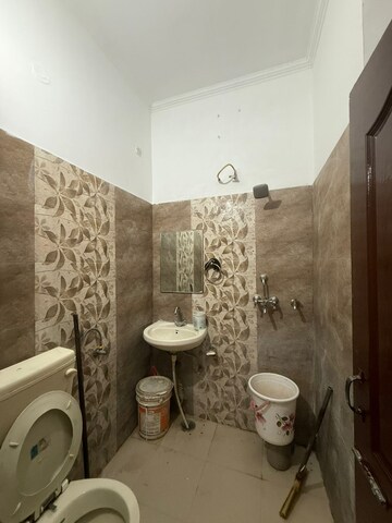 Bathroom in 1 BHK Apartment at Guru Nanak Enclave, Dhakoli – for Sale