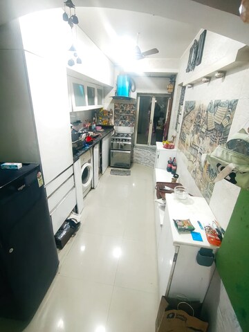 Kitchen in 2 BHK Apartment at Sai Baba Vihar Complex, Ghodbunder Road – for Sale
