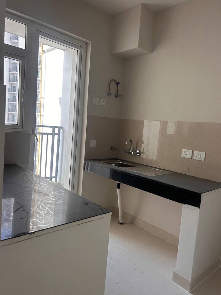 Kitchen, eldeco-live-by-the-greens 2 Bedroom 1137 Sq.Ft. Apartment In Sector 150 Noida 9492349