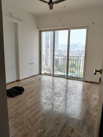 Room in 2 BHK Apartment at Wadhwa Elite, Kolshet Road – for Rent