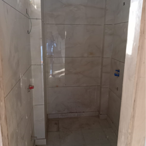 Bathroom in 3 BHK Apartment at Vashisht Heights, Bharat Colony – for Rent