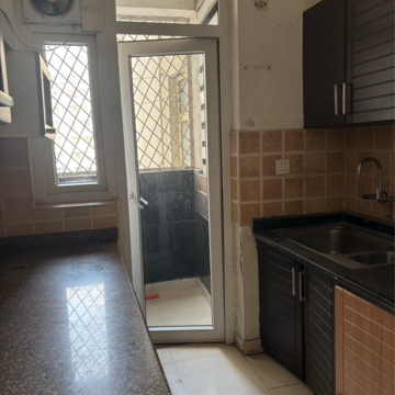 Kitchen in 3 BHK Apartment at Amrapali Eden Park, Sector 51 – for Rent