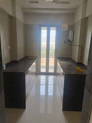 Kitchen in 3 BHK Apartment at Jayesh Shiv Parvati CHS, Kandivali West – for Sale