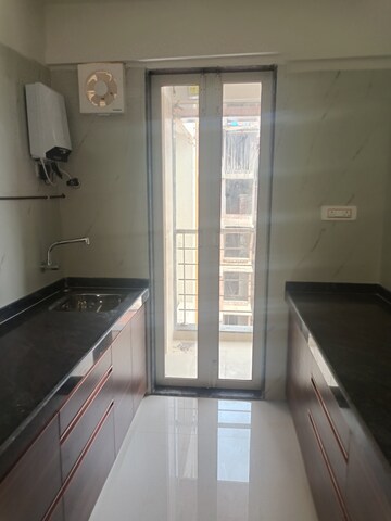 Kitchen in 2 BHK Apartment at Jayesh Shiv Parvati CHS, Kandivali West – for Sale